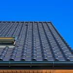vertical low angle closeup shot of the black roof of a building 181624 10654